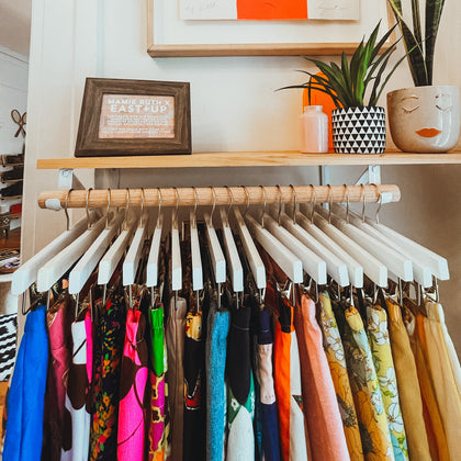 organized display, perfectly spaced, color coordinated pants, fun vintage patterns, fun colors, snake plant, east and up