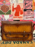 Brown leather scalloped imprinted flat purse