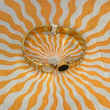 white/black circle bracelet gold